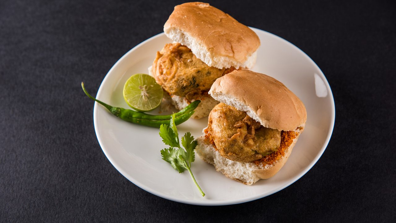 Vada Pav OR Wada Pao is Indian style Desi Burger, is a roadside fast food dish from Maharashtra. Selective focus