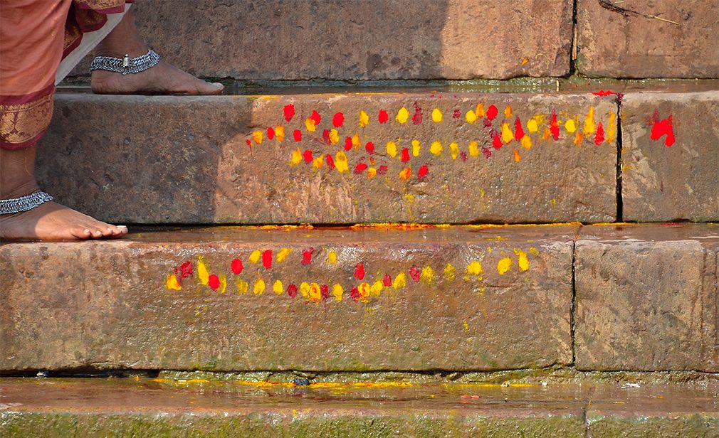 Ganges river stairs painted with dots at Varanasi