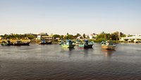 Many fishing boats in Daman Ganga river at Nani Daman Jetty in Daman, India