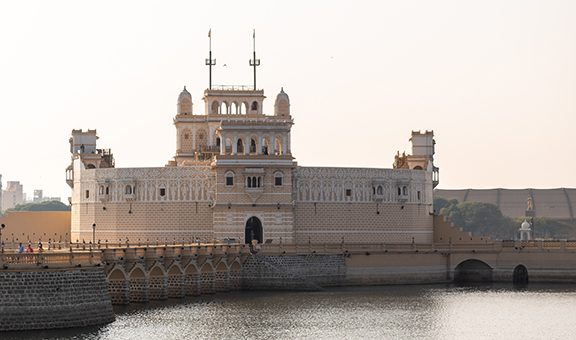 The old architecture of the ancient fortress of Lakhota Palace in Ranmal lake in the town of Jamnagar in Gujarat, India.