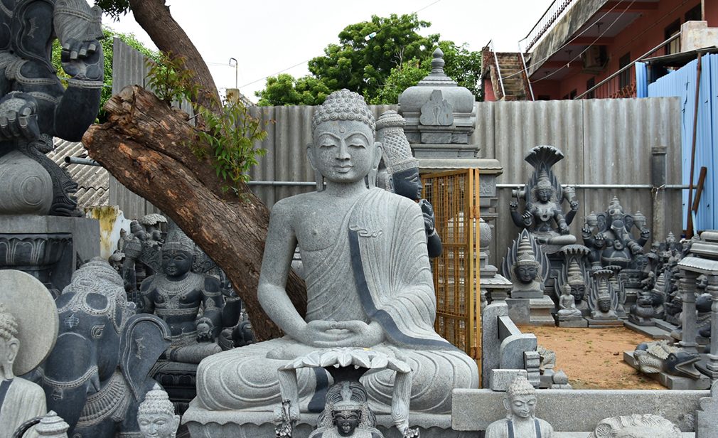 "A Buddha statue - Monolithic handmade statues found in the streets of Mahabalipuram, Tamilnadu, South India"