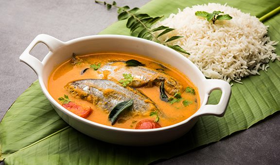 Spicy Fish Curry - kerala, konkan, bengal, goa style in Red and brown colour, served with rice