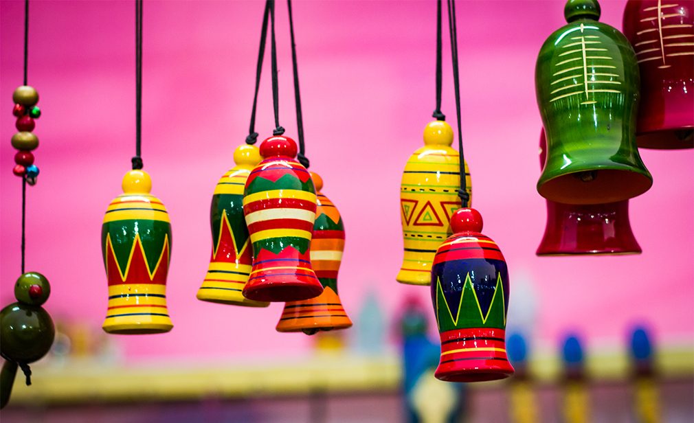 colourful wooden bells hanging by string. Musical instrument