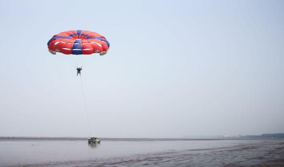 big rock in water at beach of devka beach-daman-india