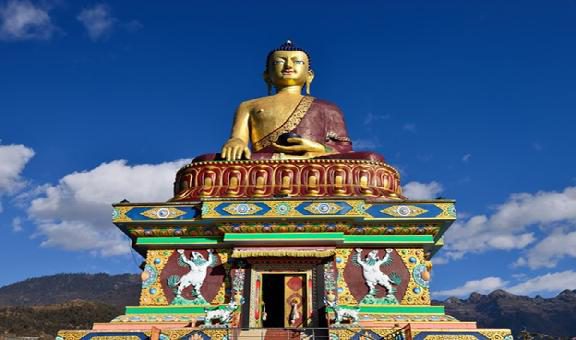 huge buddha golden statue from different perspective with bright blue sky at evening image is taken at giant buddha statue tawang arunachal pradesh india.