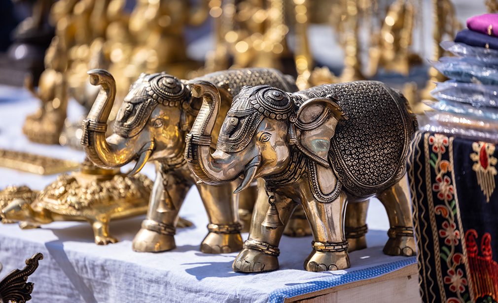 Brass metal art, Handmade Indian cultural sculpture souvenir made with brass with plain background. Selective focus.