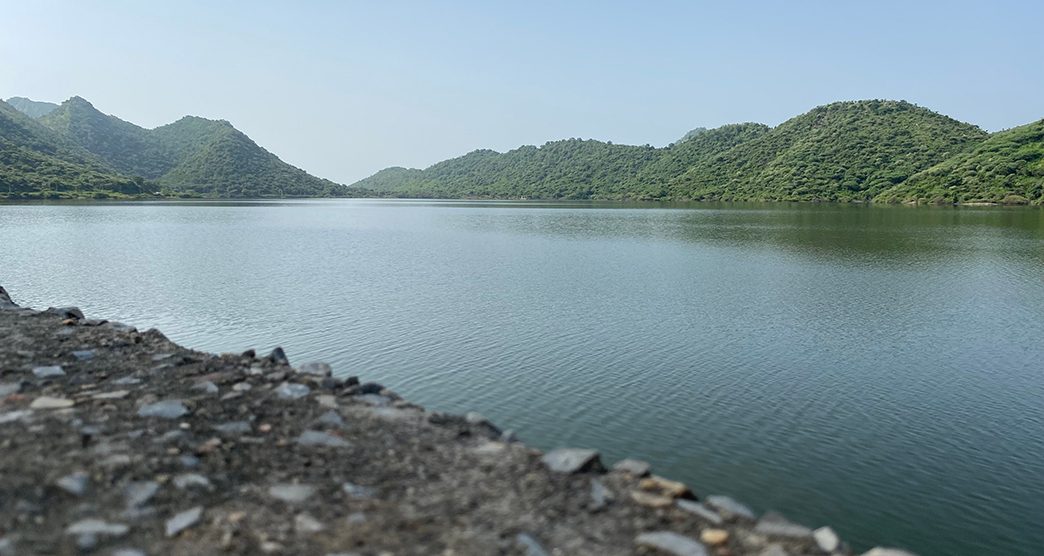 Badi lake of Udaipur with Bahubali hills on the background with blue sky