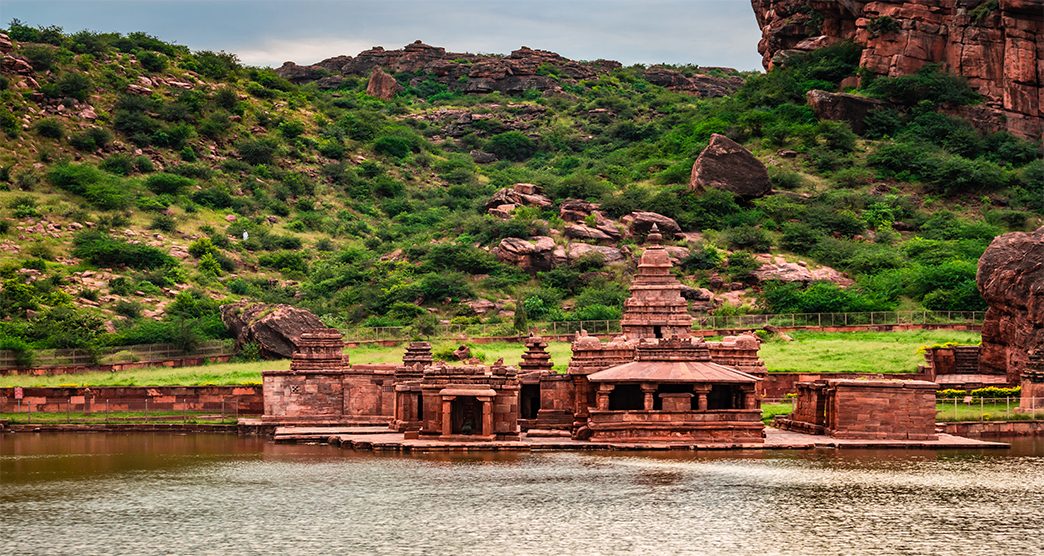 holly religious lake with ancient temple and mountain background at morning image is showing the beauty of Bhutanatha Temple on the shores of Agastya Tirtha at Badami karnataka india.