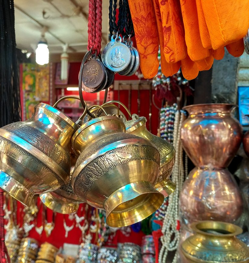 Brass vessel hanging in indian market for sell