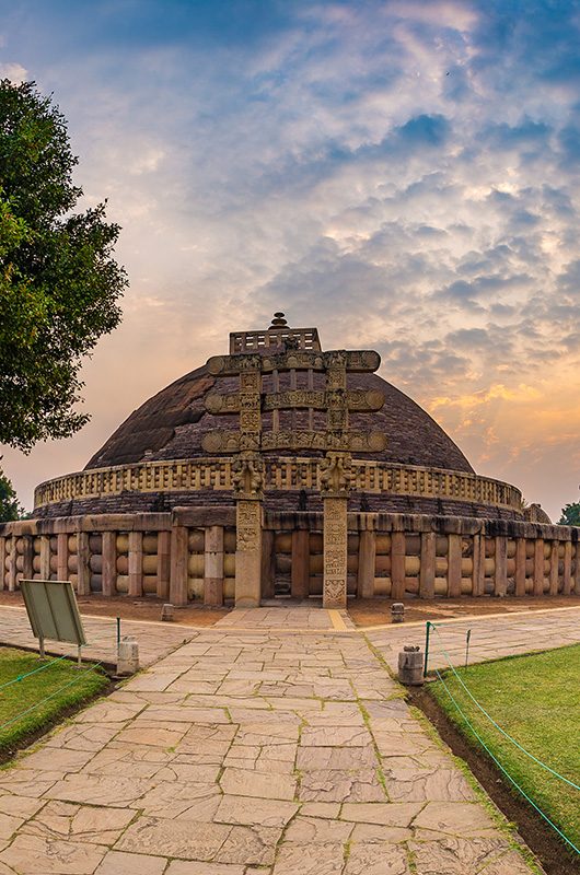 Sanchi Stupa, Madhya Pradesh, India. Ancient buddhist building, religion mystery, carved stone. Sunrise sky.