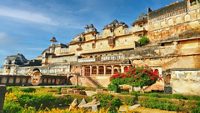 Bundi palace view with nearby greenery against a blue sky in India