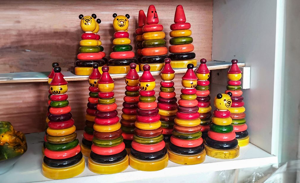 Colourful ring wooden stacking doll figures. Channapatna toy town in India. Handicraft art work of the place. gifts and souvenir. Traditional wooden toys art form started in the reign of Tipu Sultan.