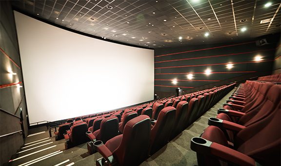 Empty cinema auditorium with screen and seats. Mock Up.
