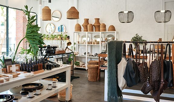 Interior of a stylish boutique full of an assortment of housewares, bags and accessories for sale