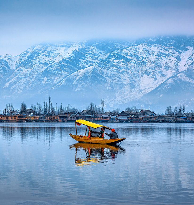 A view of Dal Lake in winter, and the beautiful mountain range in the background in the city of Srinagar, Kashmir, India.