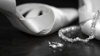 Wedding shoes and jewellery taken in black and white