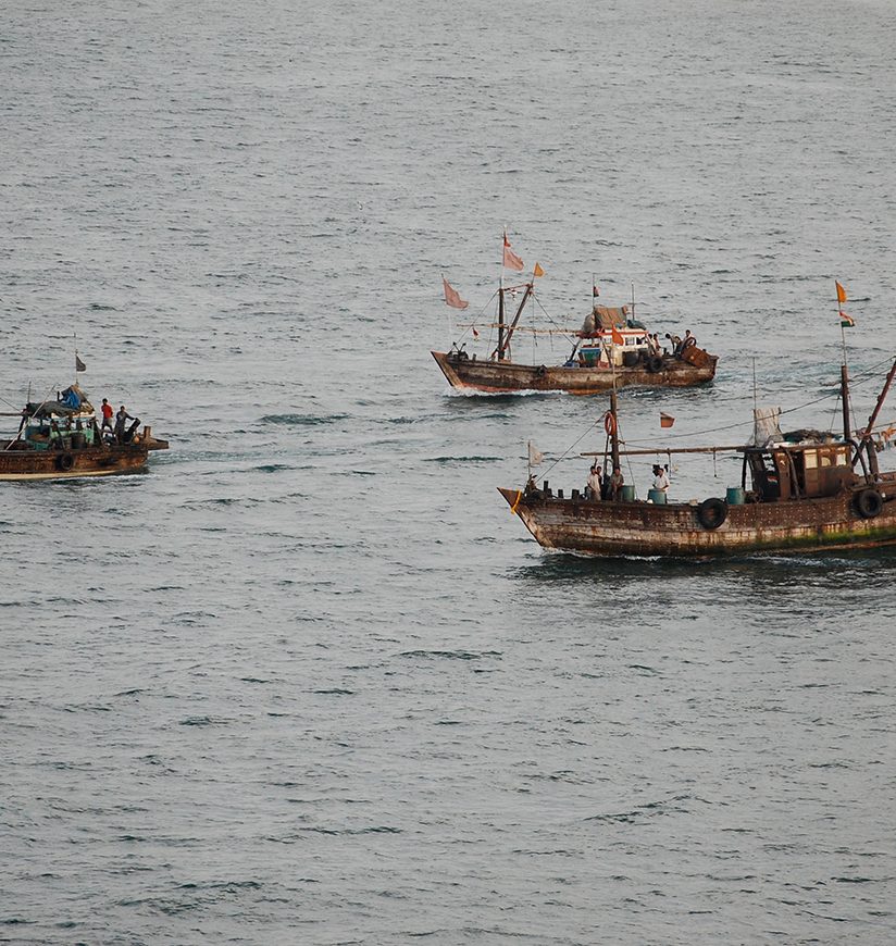 Shipyard work and ships in the Arabian Sea in Porbandar, India