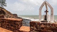 Catholic old cross on a brick wall of Fort Aguada, the coast of Arabian Sea in Goa; Shutterstock ID 1564650595; purchase_order: -; job: -; client: -; other: -