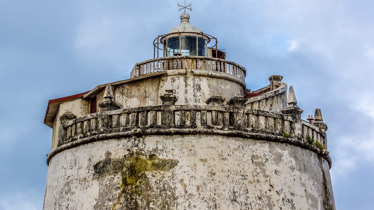Fort Aguada and its lighthouse - well-preserved seventeenth-century (1613) Portuguese fort standing in Goa, India, on Sinquerim Beach at shore of the Mandovi River, overlooking Arabian Sea.; Shutterstock ID 395606782; purchase_order: -; job: -; client: -; other: -
