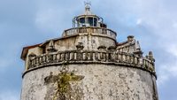 Fort Aguada and its lighthouse - well-preserved seventeenth-century (1613) Portuguese fort standing in Goa, India, on Sinquerim Beach at shore of the Mandovi River, overlooking Arabian Sea.; Shutterstock ID 395606782; purchase_order: -; job: -; client: -; other: -