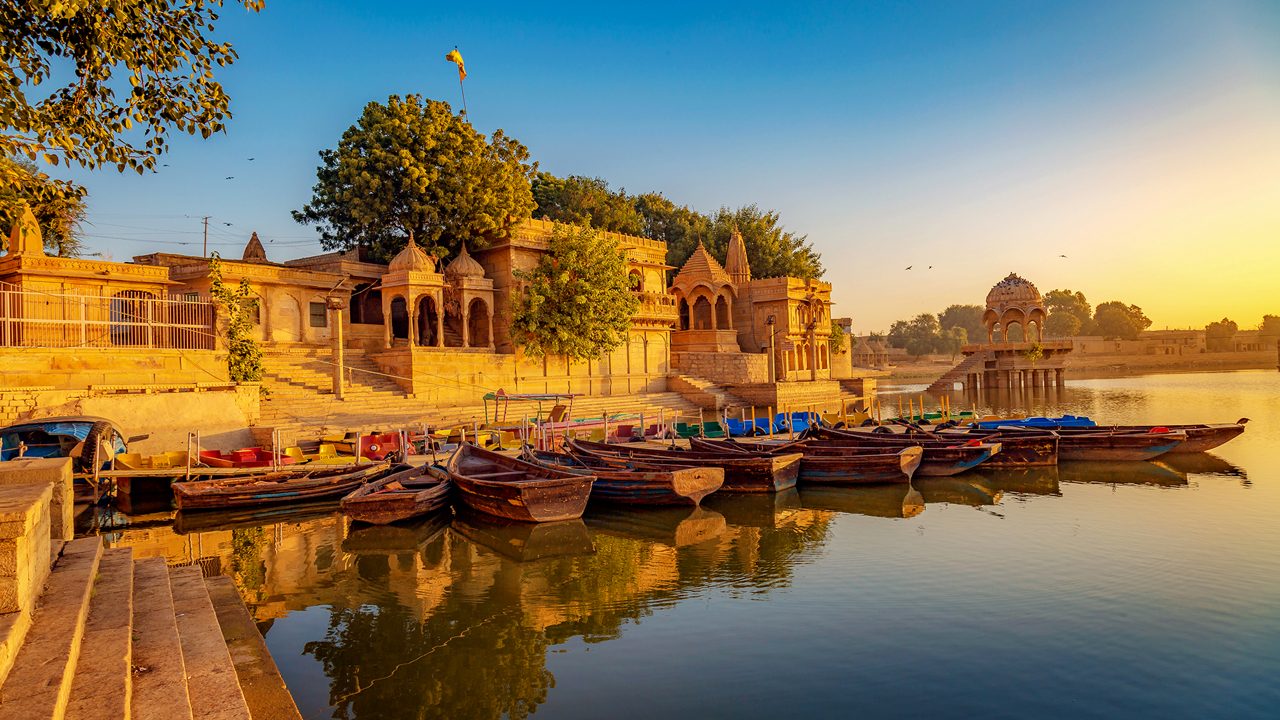 Gadi Sagar Lake (Gadisar) - A popular tourist destination in Jaisalmer Rajasthan with ancient temples and architecture at sunrise.