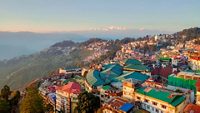 The beautiful Gangtok City from the Rope-way with a background of golden color Kangchenjunga and blue sky