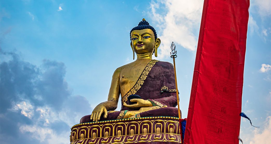 huge buddha golden statue from different perspective with bright blue sky at evening image is taken at giant buddha statue tawang arunachal pradesh india.