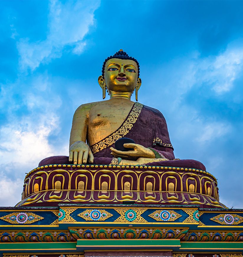 huge buddha golden statue from different perspective with moody sky at evening image is taken at giant buddha statue tawang arunachal pradesh india.