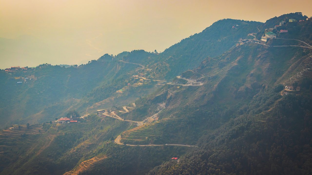 An Aerial landscape view of Mussoorie or Mussouri hill top peak city located in Uttarakhand India with colorful buildings