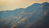 An Aerial landscape view of Mussoorie or Mussouri hill top peak city located in Uttarakhand India with colorful buildings