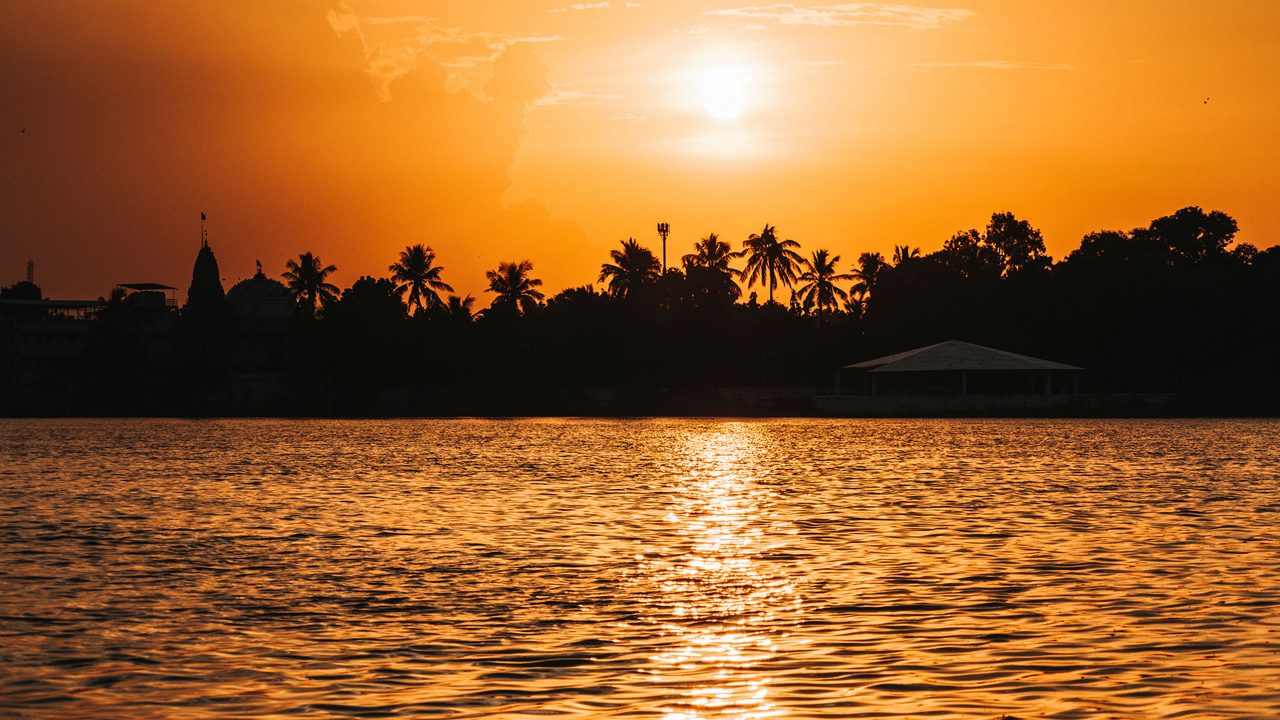 Beautiful orange sunset at lake. At Hamirsar lake in Bhuj, Kutch, India