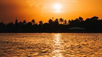 Beautiful orange sunset at lake. At Hamirsar lake in Bhuj, Kutch, India