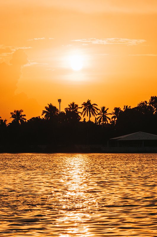 Beautiful orange sunset at lake. At Hamirsar lake in Bhuj, Kutch, India