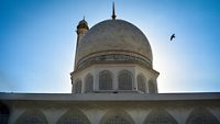 Minaret and top dome of Hazratbal Shrine which is considered the holiest mosque in Kashmir valley; Shutterstock ID 1593096337; purchase_order: -; job: -; client: -; other: -