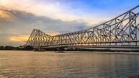 Historic Howrah bridge - The cantilever bridge on river Hooghly at sunset with moody sky.; Shutterstock ID 703393621; purchase_order: -; job: -; client: -; other: -