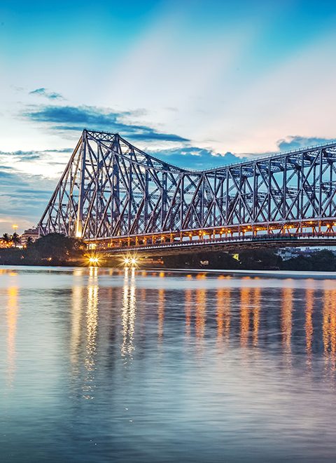 Howrah bridge - The historic cantilever bridge on the river Hooghly with twilight sky. Howrah bridge is considered as the busiest bridge in India.; Shutterstock ID 677901256; purchase_order: -; job: -; client: -; other: -