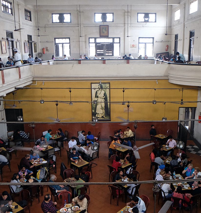 KOLKATA, INDIA - FEBRUARY 11: Visitors of popular Indian Coffee House have lunch in Kolkata on February 11,2016. The India Coffee House chain was started by the Coffee Cess Committee in 1936 in Bombay