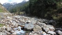 A stream flowing by the Jagatsukh Village near Manali in Himachal Pradesh, India