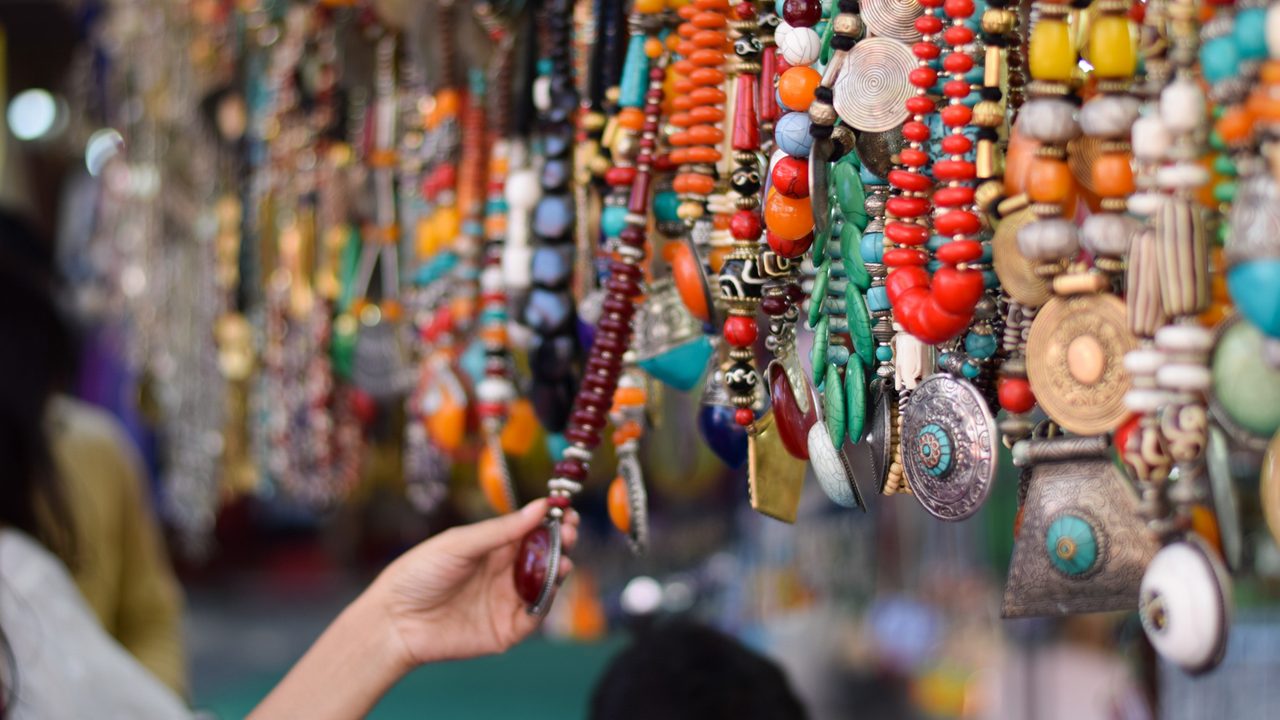 Girl Buying Indian Traditional Handmade Jewellery in Delhi Haat INA Market. This market is famous among the foreign tourist for traditional Indian souvenirs  