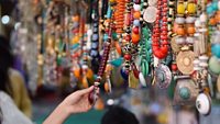 Girl Buying Indian Traditional Handmade Jewellery in Delhi Haat INA Market. This market is famous among the foreign tourist for traditional Indian souvenirs  