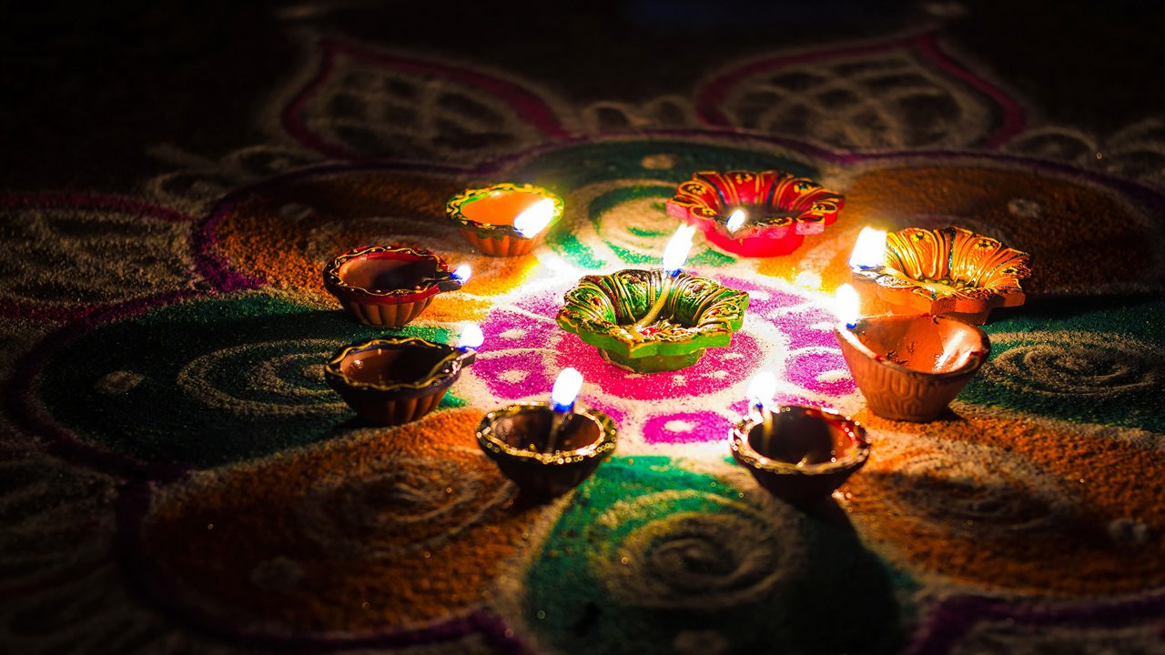 Circa 2018. Oil candles, also called Deepams, are lighted on a rangoli design to celebrate the festival of Karthigai Deepam.