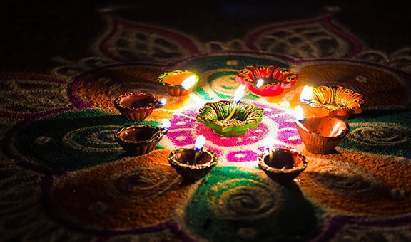 Circa 2018. Oil candles, also called Deepams, are lighted on a rangoli design to celebrate the festival of Karthigai Deepam.