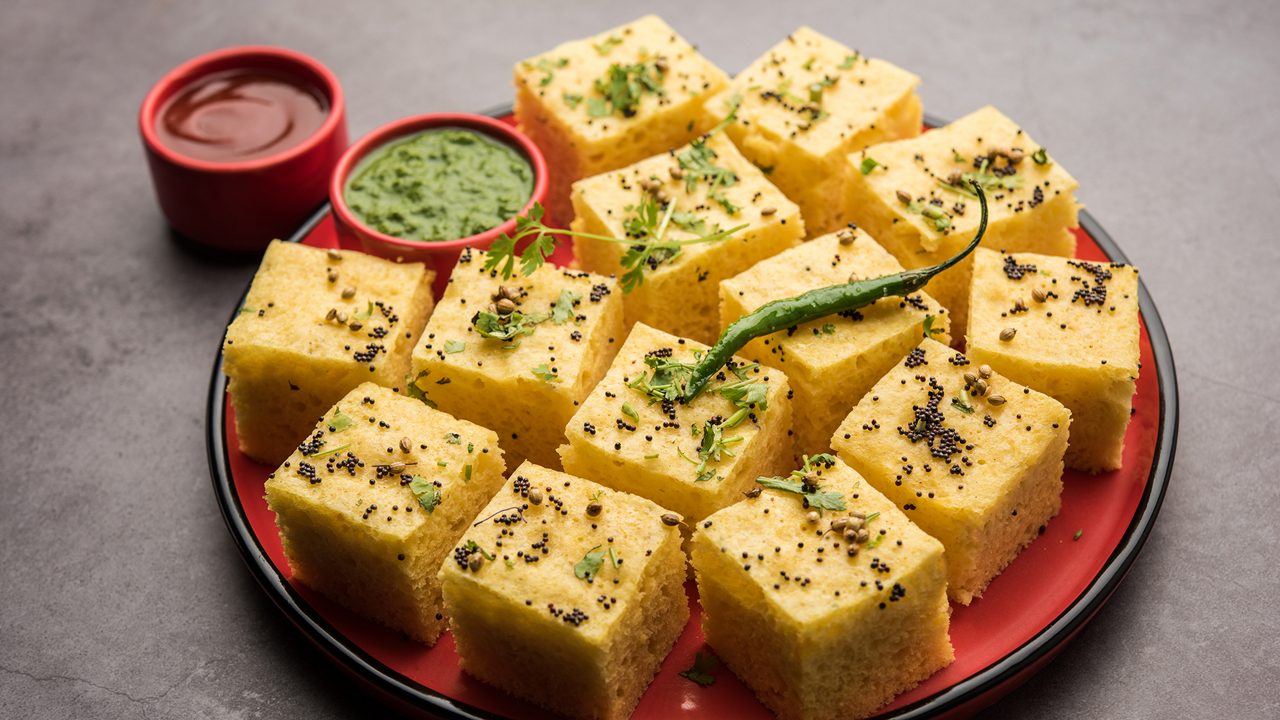 Gujarati Khaman Dhokla made using Chana Dal, served with Green chutney, selective focus