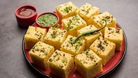 Gujarati Khaman Dhokla made using Chana Dal, served with Green chutney, selective focus