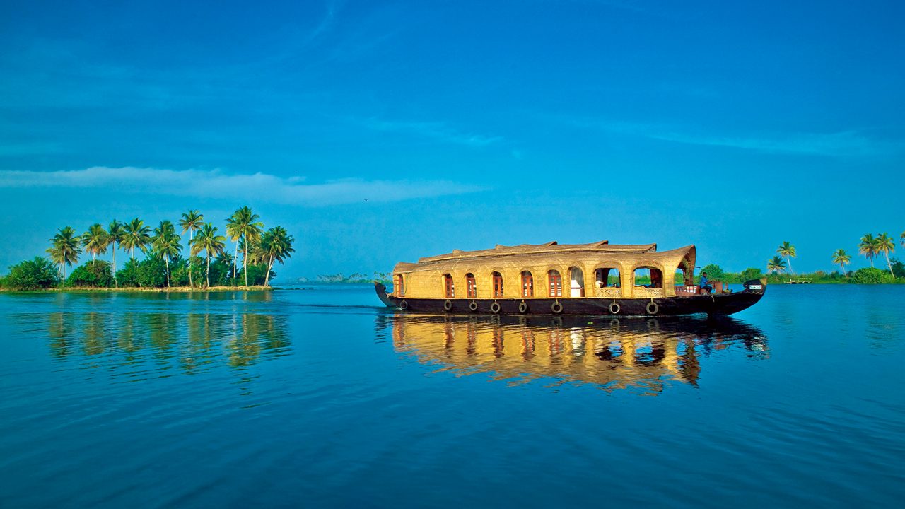 House boat under blue sky from Alleppey or AlappuzhaKerala.Kerala Backwaters, houseboat Photo