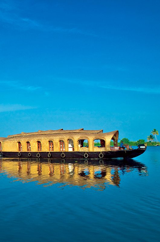 House boat under blue sky from Alleppey or AlappuzhaKerala.Kerala Backwaters, houseboat Photo