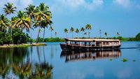 Travel tourism Kerala background - houseboat on Alleppey backwaters.  India.Kerala houseboat image