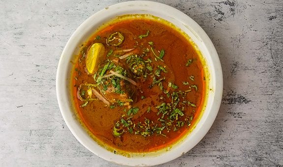 Spicy beef nihari served in a plate isolated on background top view of indian and pakistani desi food