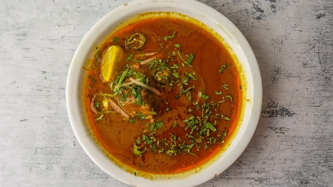 Spicy beef nihari served in a plate isolated on background top view of indian and pakistani desi food