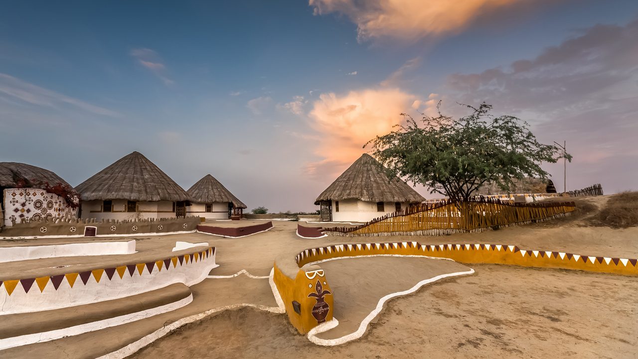 KUTCH, GUJARAT, INDIA: traditional mud huts with thatched roof and painted decoration, called Bhunga